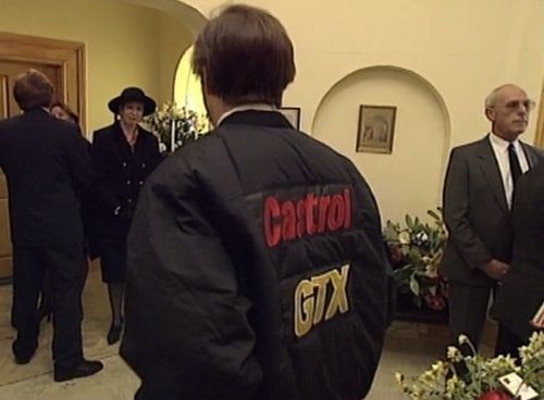 Alan Partridge wearing a Castrol GTX jacket to Tony Hayers' funeral.