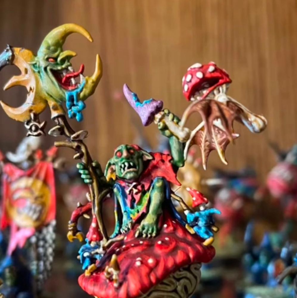 A little guy enjoying the most kaleidoscopic of mushrooms at Sigmarbury the only new age festival in all of Sigmar.