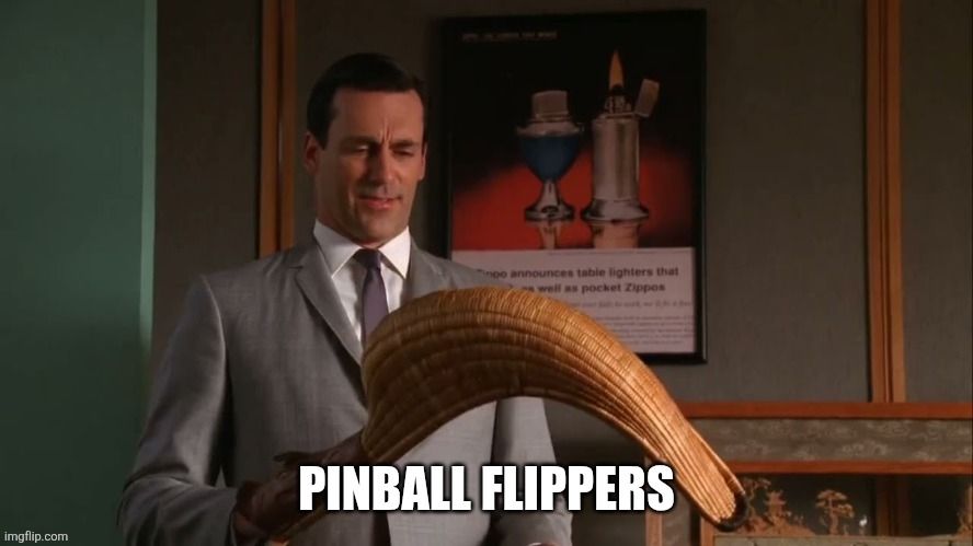 Don Draper looking quizzically at a holding a jai alai cesta that he's holding. The impact text on top reads "Pinball flippers"