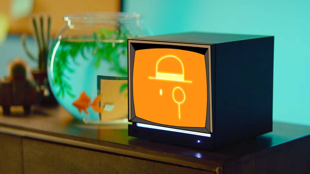 Steam machine with B.A.C.S the computer from Void Bastards edited on the front panel. An orange display with a monocle wearing computer program wearing a top hat.