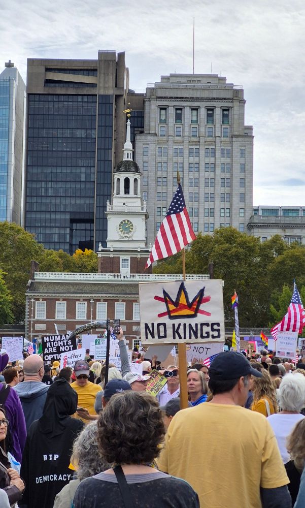 No kings sign and American flag displayed in front of Independence Hall in Philadelphia with thousands of protesters 