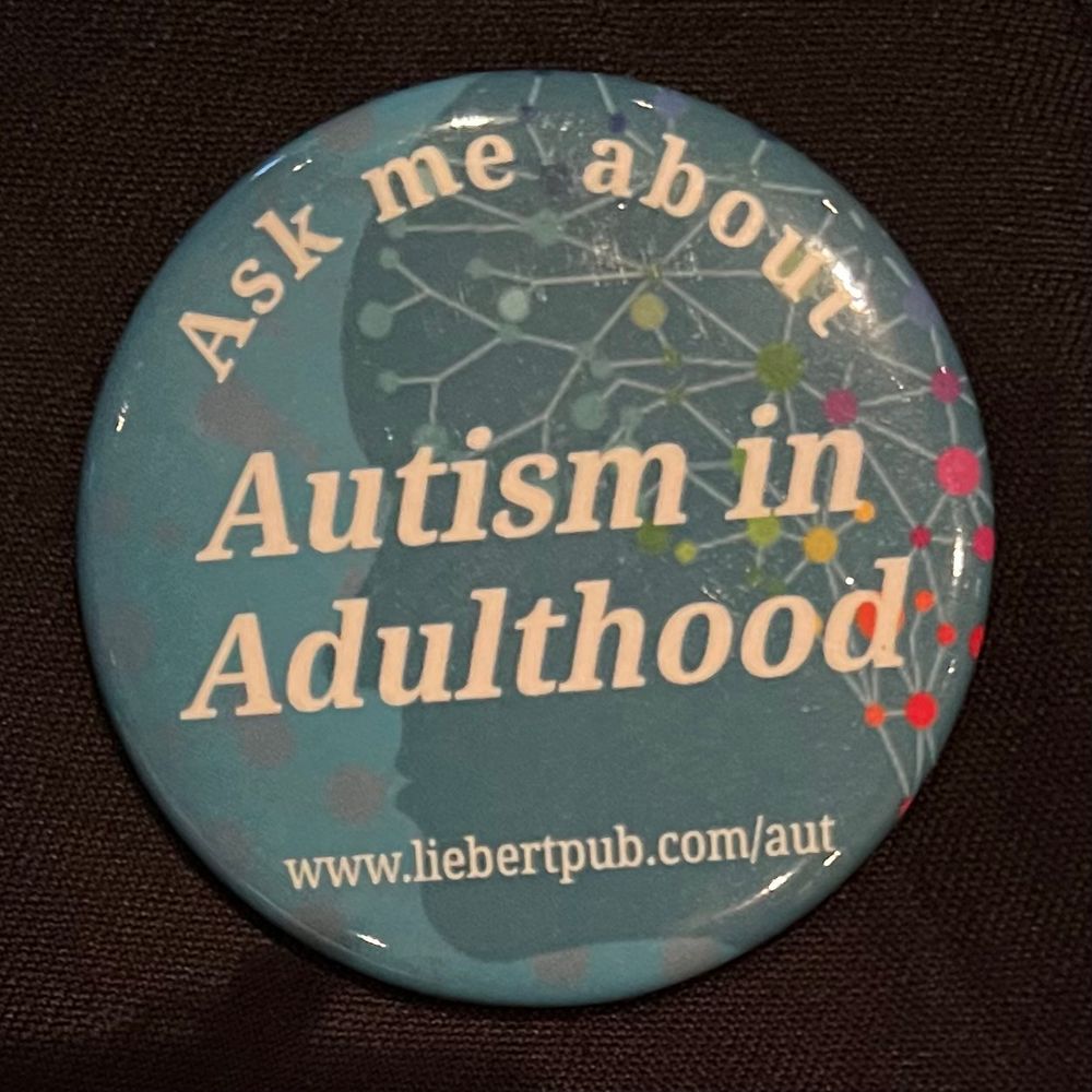 Blue button that says Ask me About Autism in Adulthood www.liebertpub.com/aut. 