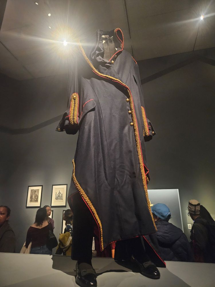 A photo of André Leon Talley's iconic military inspired coat from designer John Galliano for House of Dior