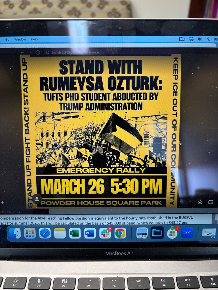 Black and yellow sign STAND WITH RUMEYSA OZTURK Tufts PhD Student Abducted by Trump Administration EMERGENCY RALL MARCH 26 5:30 PM
