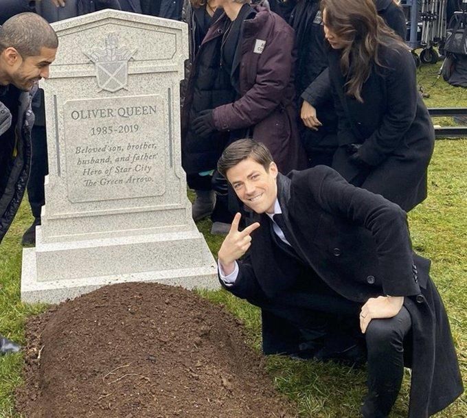 Standing over grave with a peace sign meme