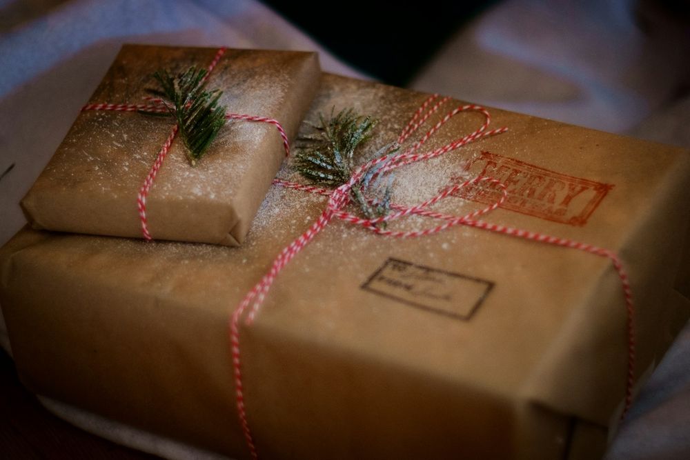 Brown paper packages tied up with strings... plus some greenery and fake snow.