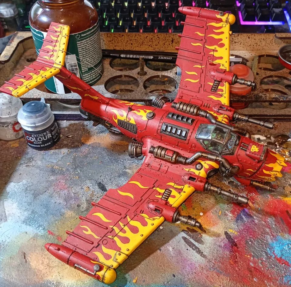 red ork plane with yellow flame pattern