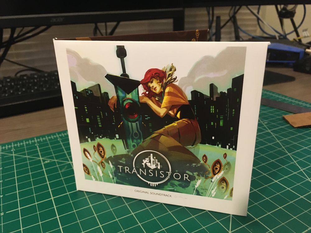 The front cover of the case, showing Red sitting next to the titular sword