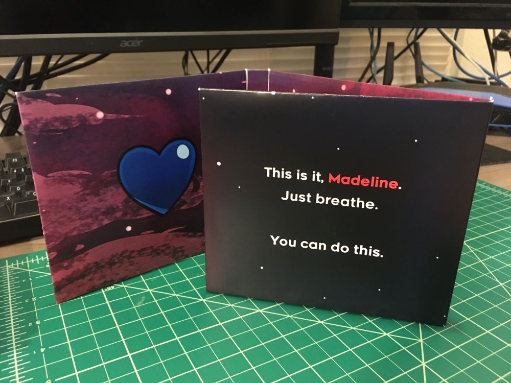 Interior panel of the first gatefold, showing the quote "This is it, Madeline. Just breathe. You can do this." from the game