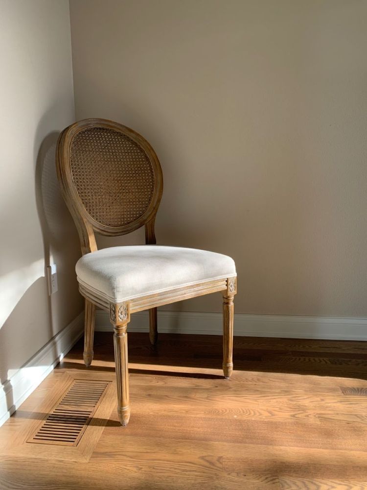 A single chair in the corner of a room. Only Stephen Miller sits in this chair.