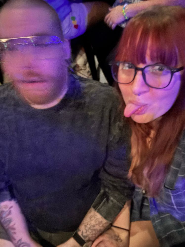 My husband (left) blurry like a cryptid while I (right) stick out my tongue again