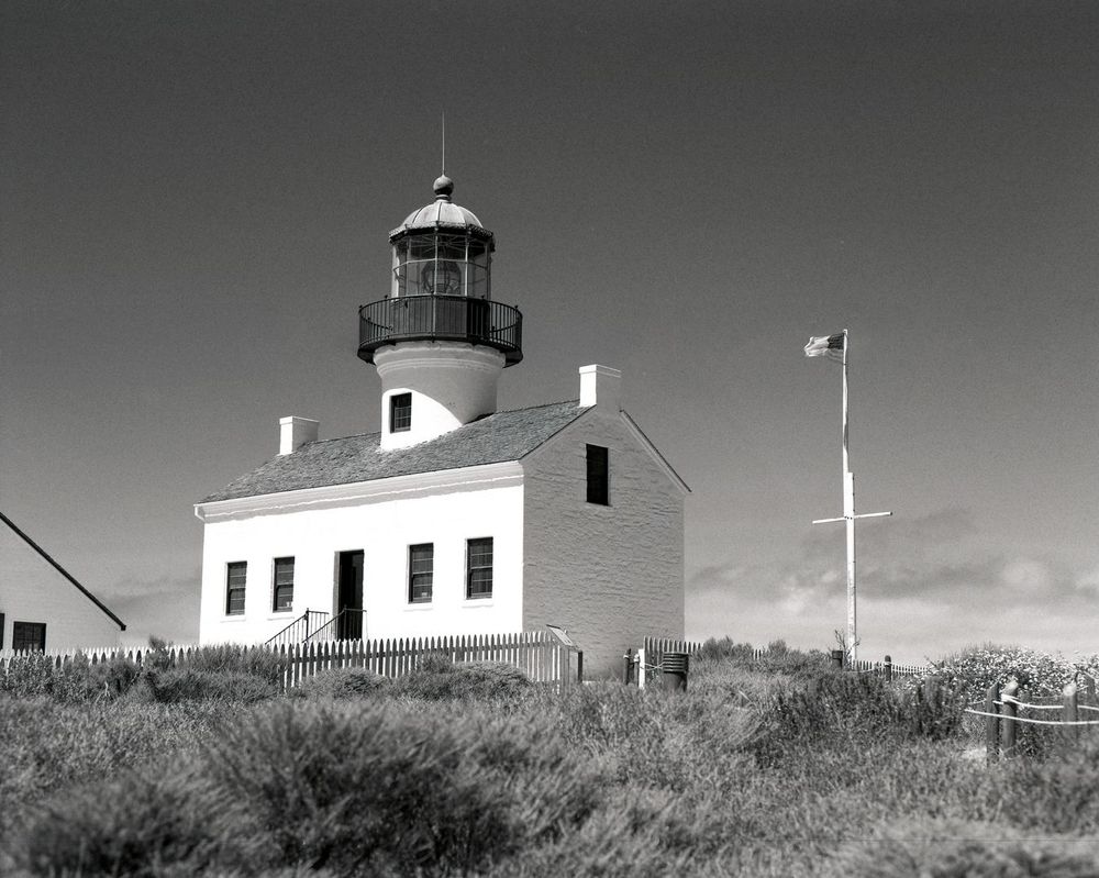 The original Point Loma lighthouse was one of 6 lighthouses constructed by the US Govt. when California was admitted to the Union. 

Construction was completed in 1855 on, when operating, what was the highest elevation lighthouse in the United States. On foggy nights the lighthouse keeper would sometimes discharge a shotgun to warn ships away. 

On March 23, 1891, the flame was permanently extinguished and the light was replaced by the New Point Loma lighthouse at a lower elevation.