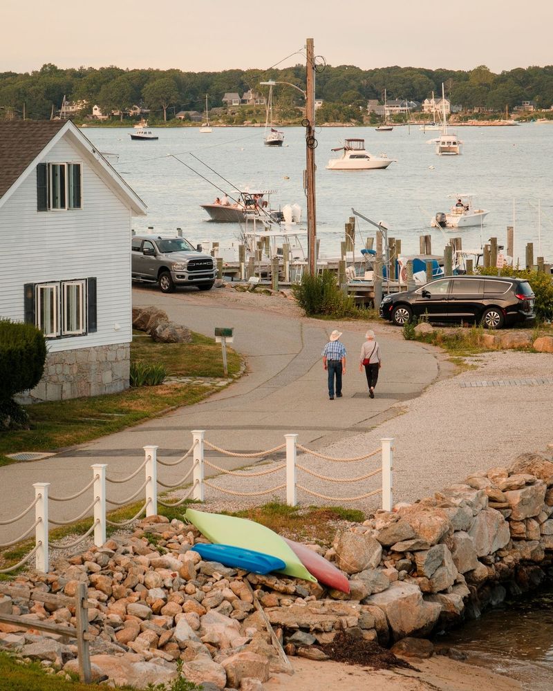 A couple walks down to the harbor in Noank, Groton, Connecticut