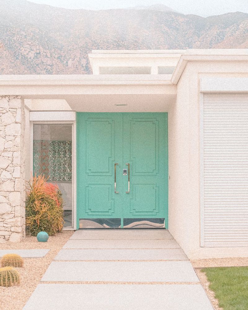Mint green doors on a mid-century modern home in Palm Springs, California.