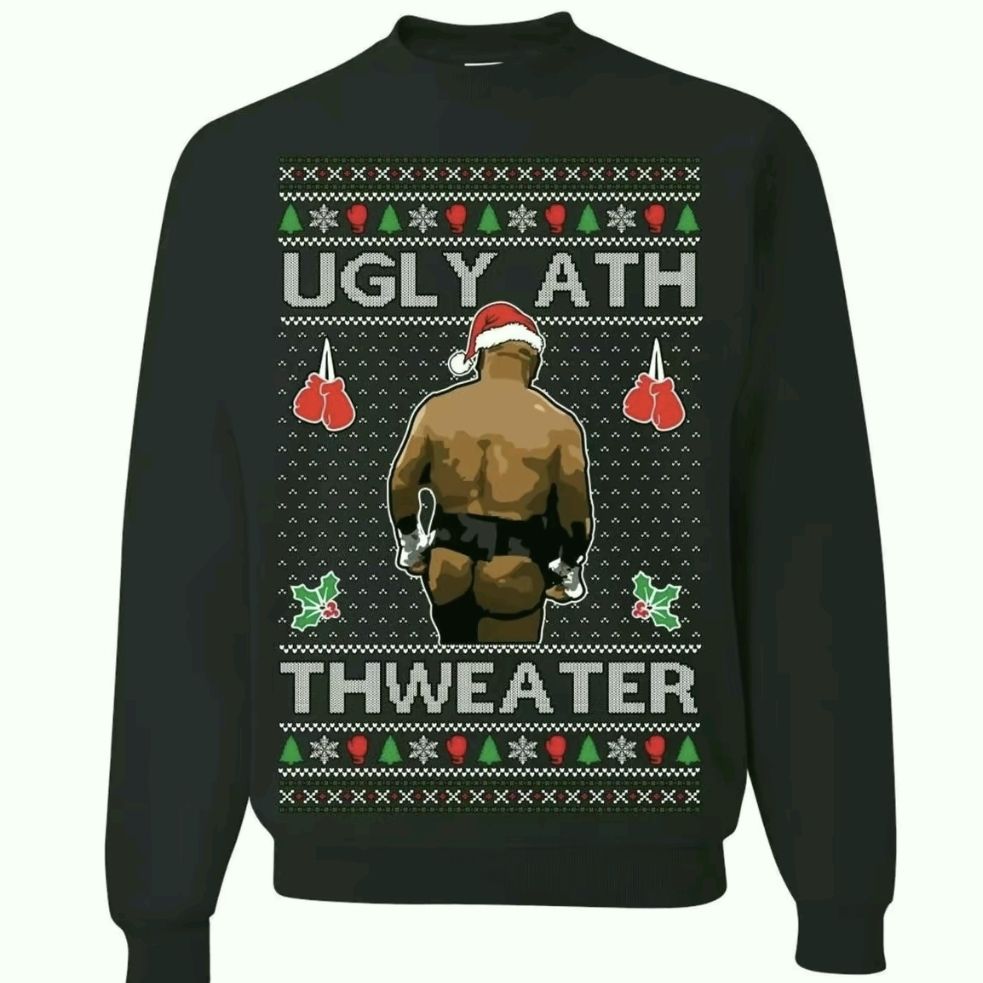 Dark green sweater with tacky Christmas decorations. It reads in capital letters (spelled as is) "Ugly Ath Thweater” and it features Mike Tyson with exposed buttocks in a thong wearing a Santa clothes hat, facing away. 