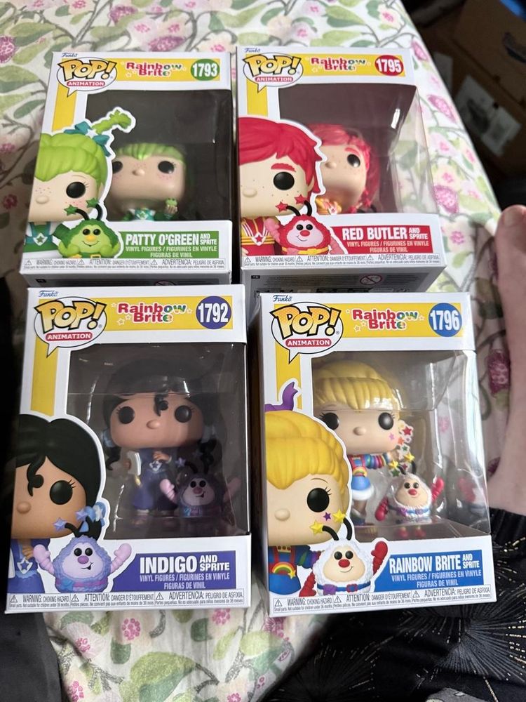 Four Funko Pops: Patty O’Green, Red Butler, Indigo, and Rainbow Brite, all with their unnamed Sprites