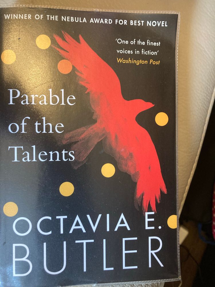 Book cover of Parable of the Talents by Octavia E. Butler showing a red bird