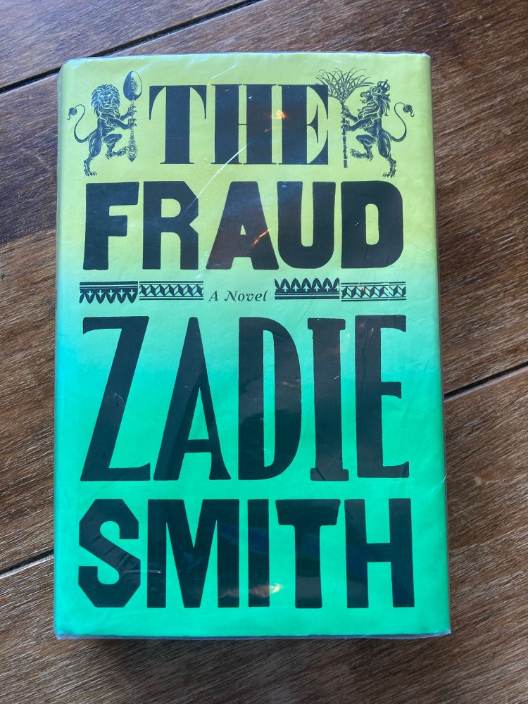 Book cover of The Fraud by Zadie Smith depicting two lions in the top corners.