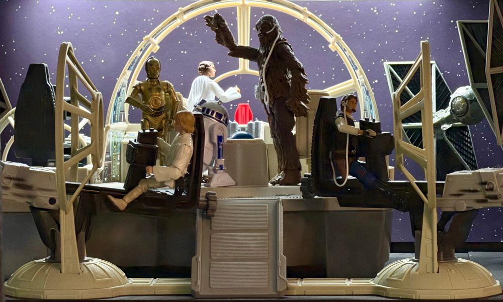 Power of the Force 2 Millennium Falcon Gunner Stations and the Millennium Falcon PC Game set displayed together with TVC figures to recreate the escape from the Death Star in A New Hope