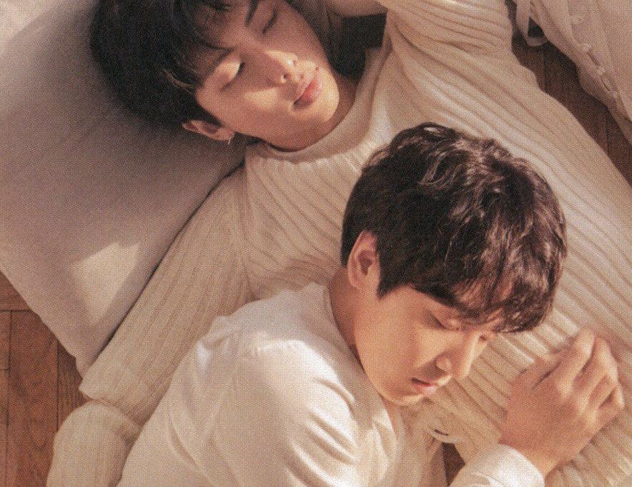 namkook both in white with their eyes closed, with jungkook lying on namjoon's chest, during a Tear photoshoot