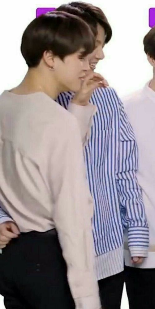 jikook standing during an interview with jungkook's hand around jimin's waist