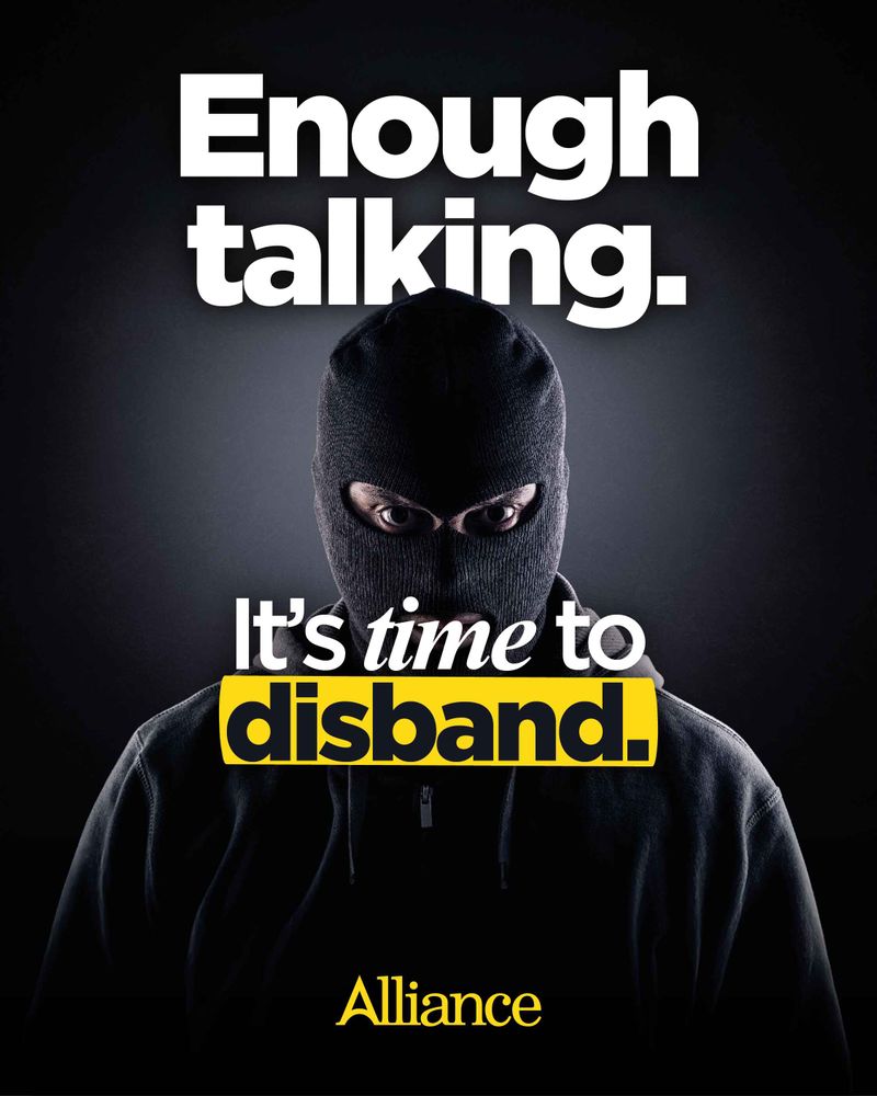 Image of a paramilitary member wearing a balaclava mask. Text reads: Enough talking. It's time to disband.