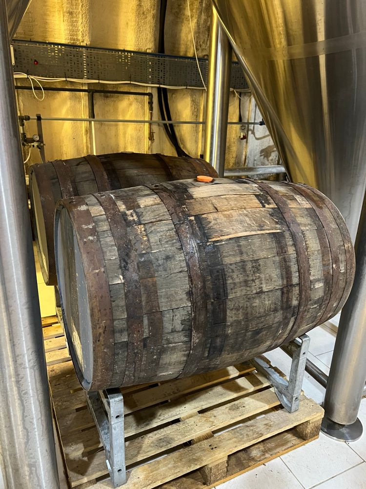 Wooden barrels of beer in the brewery at Turning Point Brew Co.