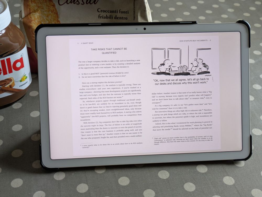 A tablet standing on a table, showing the PDF version of an article from asmartbear.com
