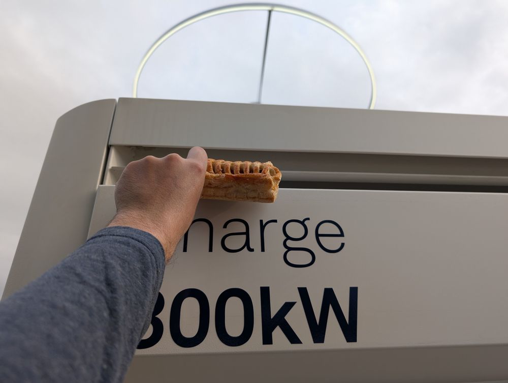 A pastry being held up to a vent. Below is the lettering "charge 300kW"