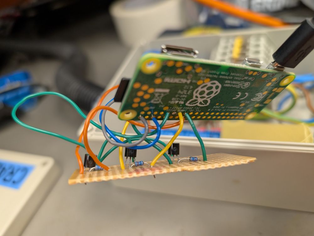A Raspberry Pi Zero connected to veroboard with messy wires in-between 
