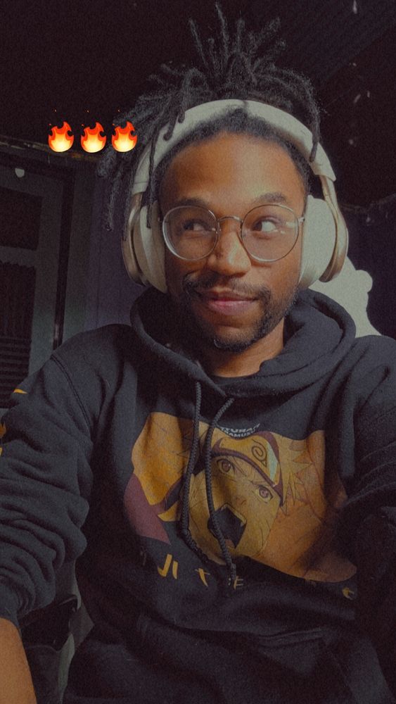 Selfie of my short locs wearing a black Naruto hoodie