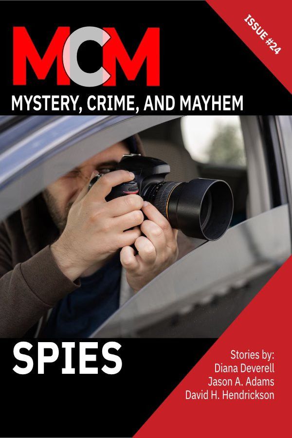 Image is a cover of the quarterly magazine MCM Mystery, Crime, and Mayhem titled Spies. The image is of a man in a car shooting photos through a long lens. 