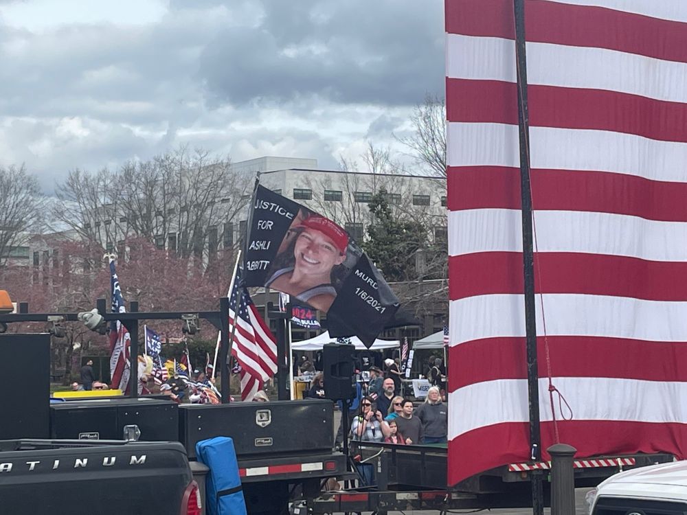 A flag at a political rally that says 
