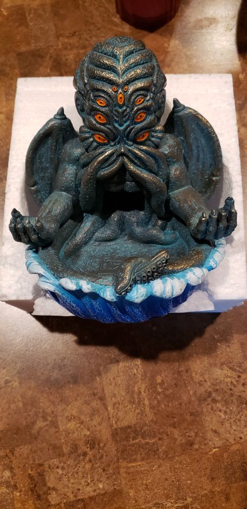 A green cthulhu dice tower