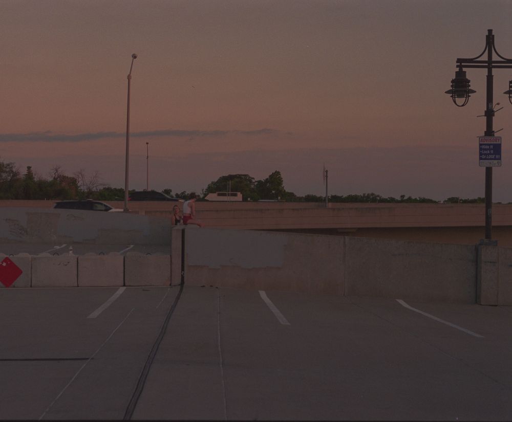 A film photo of people watching the sun set