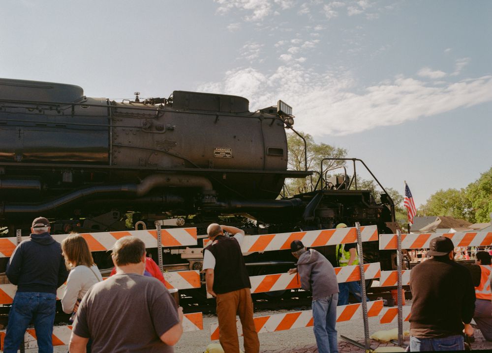 A film photo of a group of people
Admiring the big boy train 