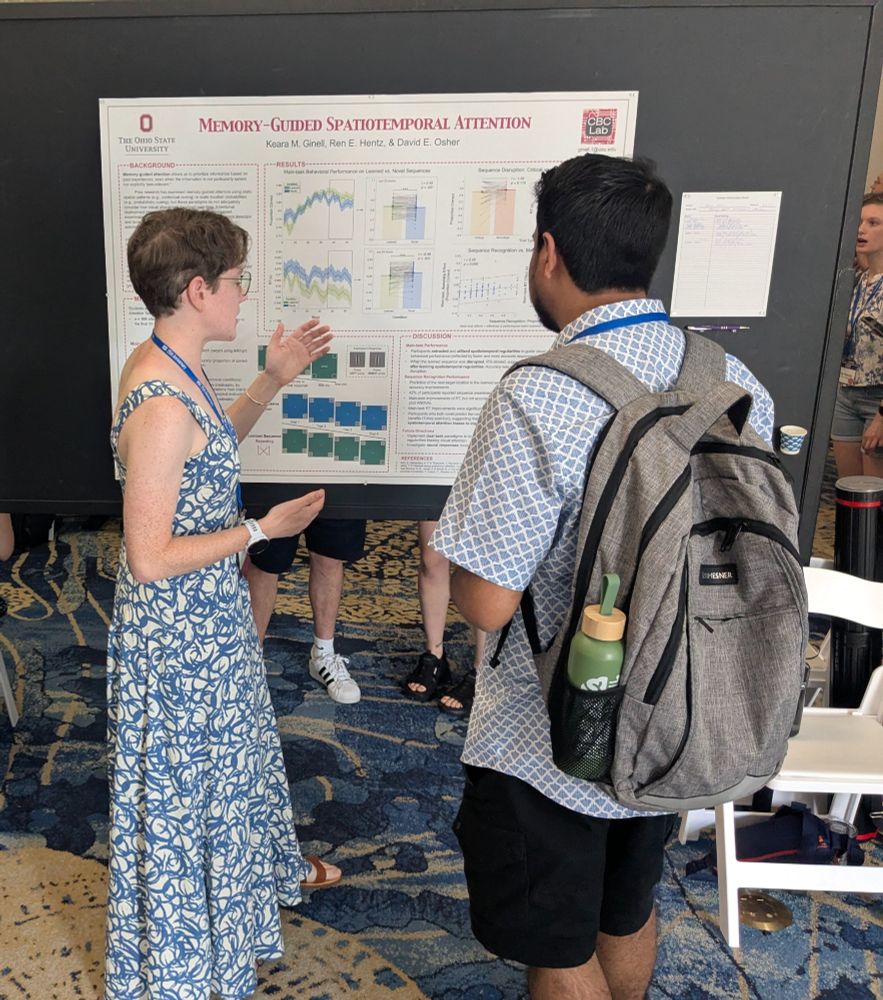 Keara explains her research poster, entitled "Memory-Guided Spatiotemporal Attention", to a fellow Vision Sciences Society conference attendee.