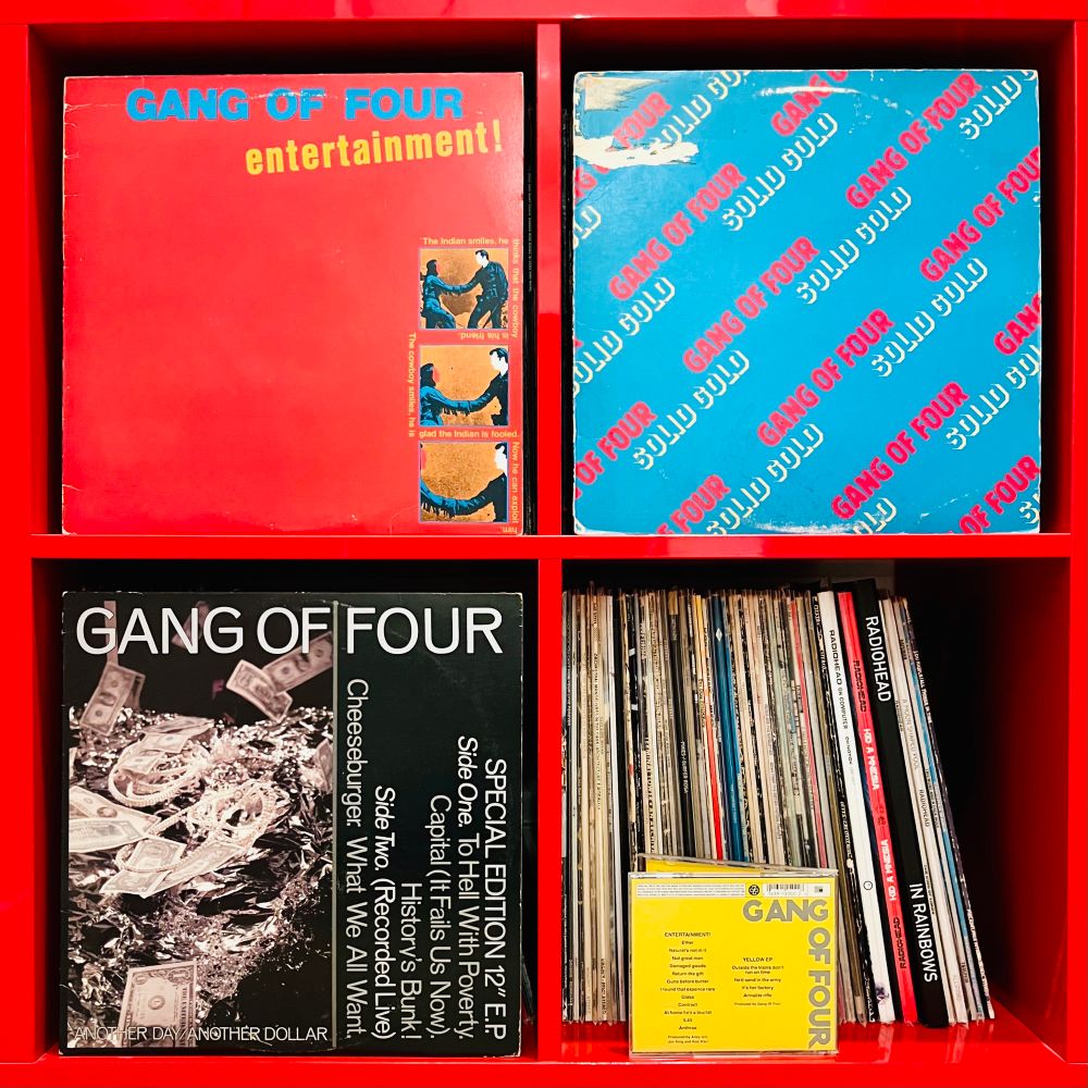 Vinyl shelf with Gang of Four’s albums, Entertainment, Solid Gold, the Another Day Another Dollar EP, and the Yellow EP on CD - on display.