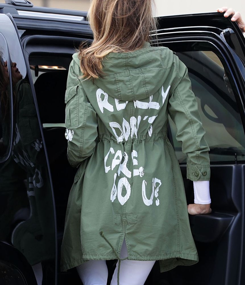A woman with a coat bearing the sentence: 