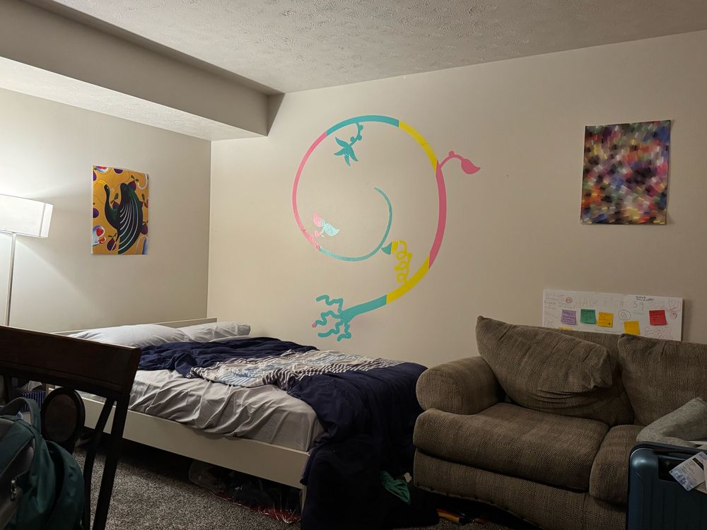 The same vine but from a wider angle and not at a straight angle. In this picture you can also see my bed, my couch, and some other much smaller art I’ve acquired on my walls