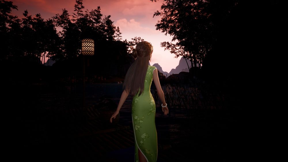 Nikki looking at the mountain in the distance - she is wearing a green Cheongsam dress