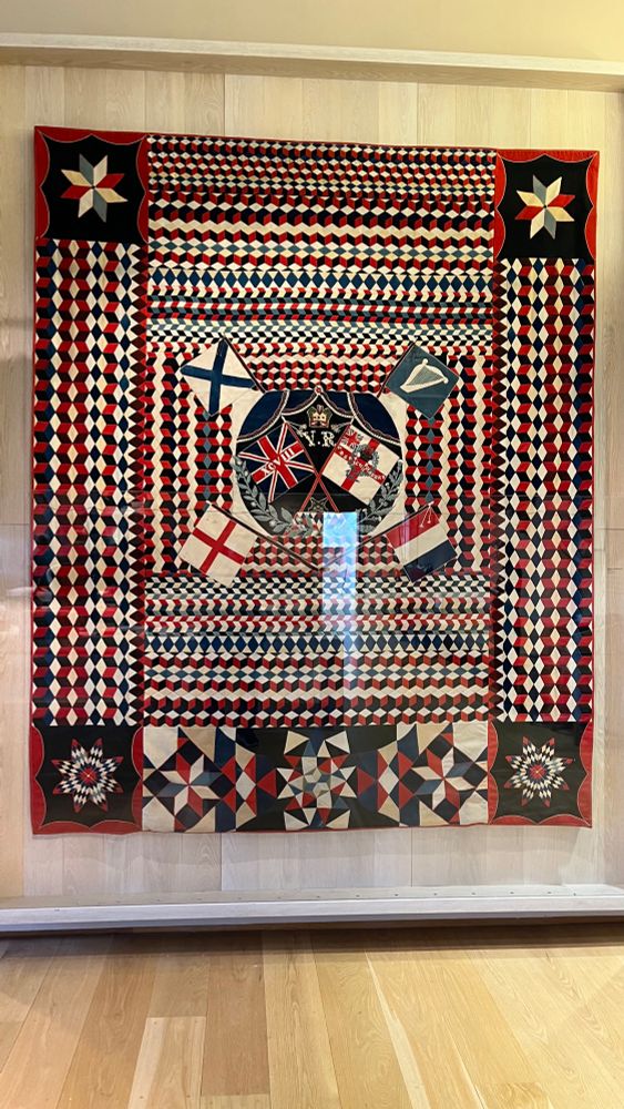 Wool patchwork in military cloth main colours red white and black. 