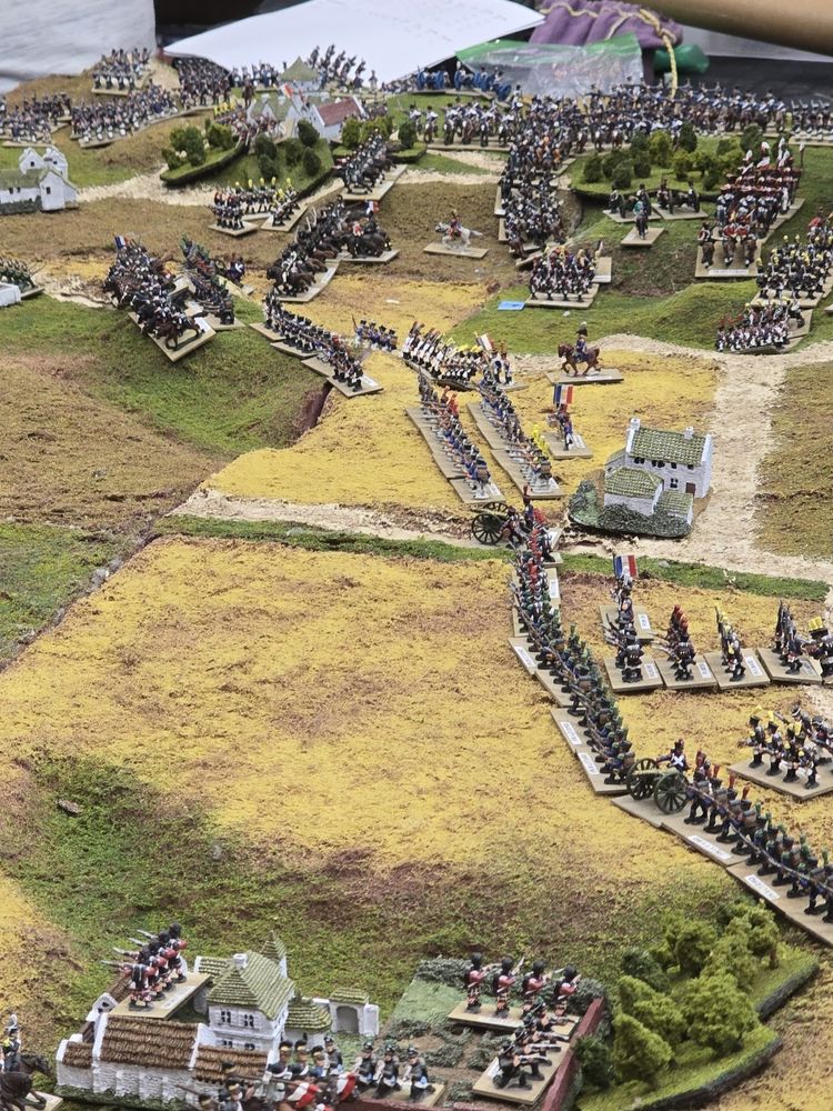 French infantry lines stretch across terrain boards, with painted 15mm figures used. Other figures visible crossing the lines at the top of the board.