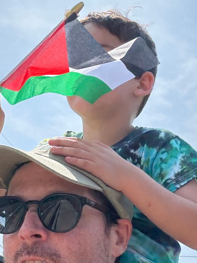 Me and my son with a small Palestinian flag 