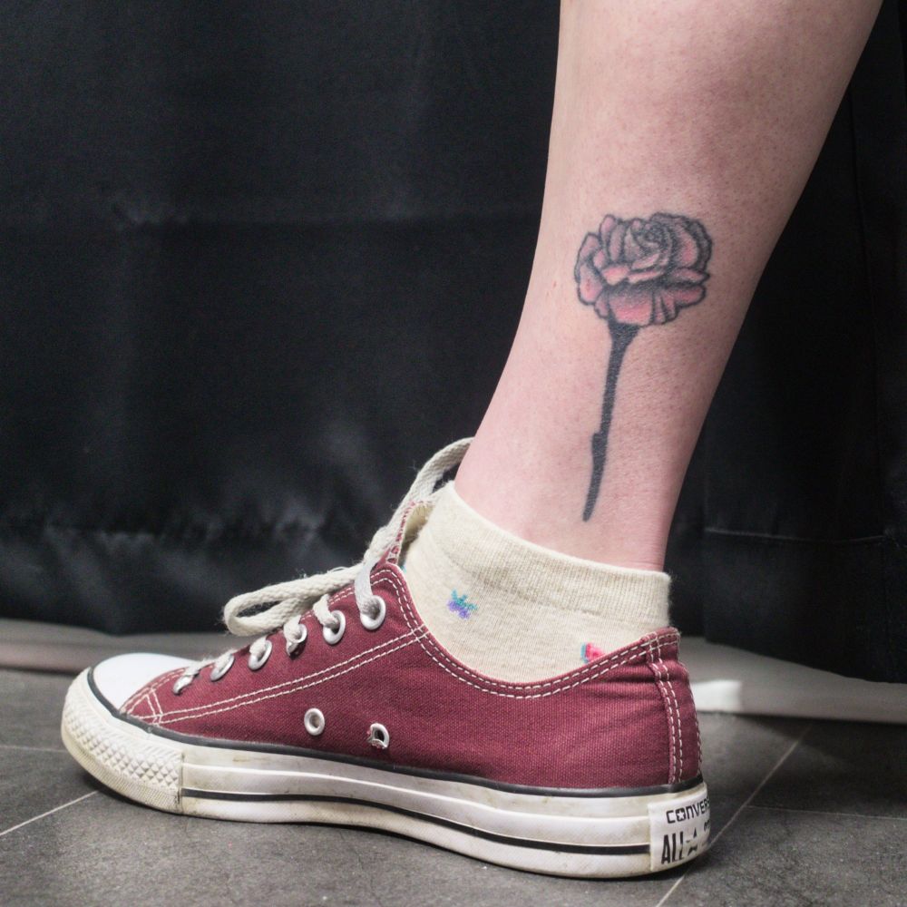 The rose tattoo before any laser tattoo removal treatments.