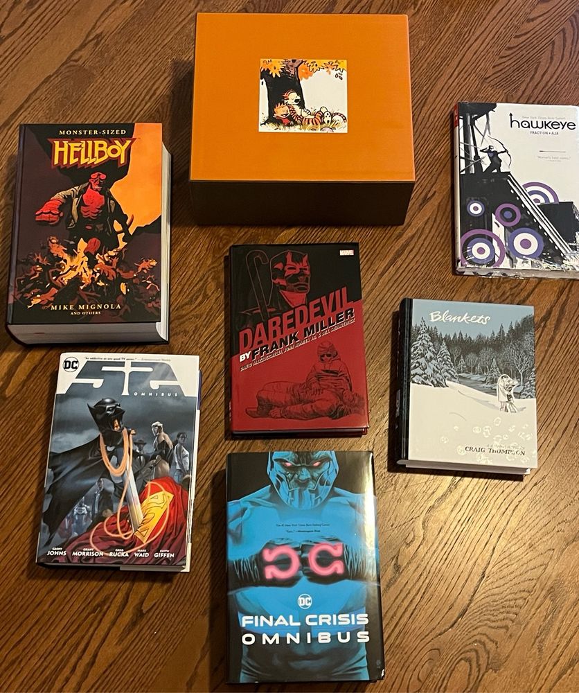 Omnibus editions of: 52, Final Crisis, Frank Miller Daredevil, Monster-sized Hellboy, Hawkeye, Blankets, and the complete Calvin and Hobbs