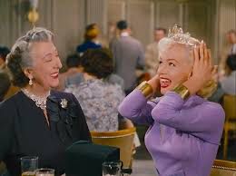 Norma Varden and Marilyn Monroe in a scene from Gentlemen Prefer Blondes. Marilyn is trying on a diamond tiara.