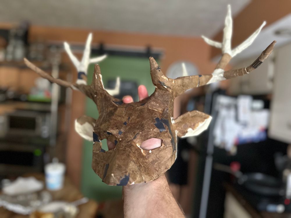 deer mask with augmented antlers and the beginnings of papier maché