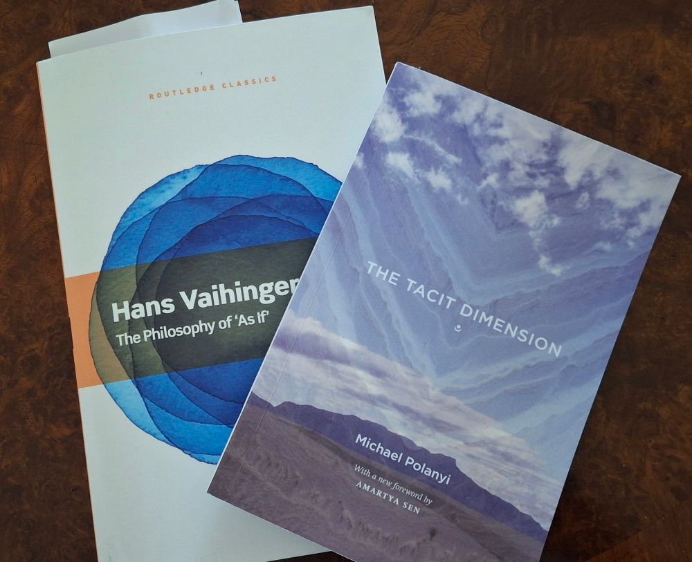 Photo of two books. On top is Michael Polanyi's "The Tacit Dimension". Beneath is "The Philosophy of 'As if'" by Hans Vaihinger. 