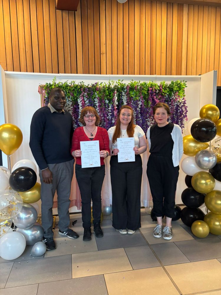 Four of the geographers in a row for a celebratory photograph. Left to right: Olalekan Adekola, Pauline Couper (with cycle helmet hair), Abby Mycroft (inspirational staff member), Jude Parks.